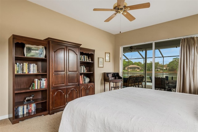 carpeted bedroom with access to exterior and ceiling fan