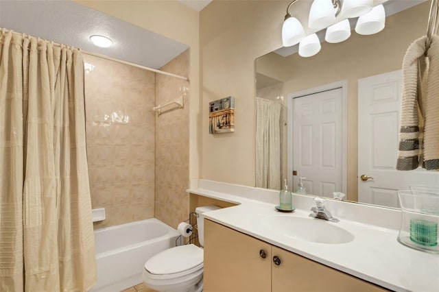 full bathroom featuring vanity, toilet, a textured ceiling, and shower / tub combo