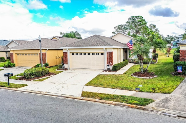 ranch-style home featuring a front yard and a garage