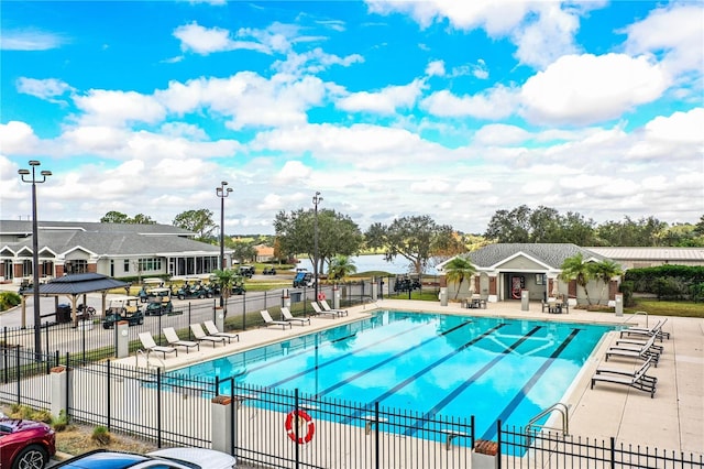 view of swimming pool featuring a patio area