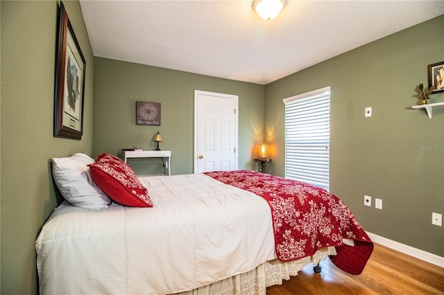 bedroom with wood-type flooring