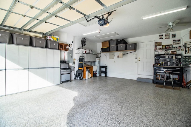 garage with ceiling fan and a garage door opener