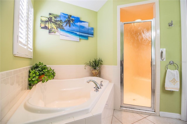 bathroom featuring tile patterned flooring and separate shower and tub