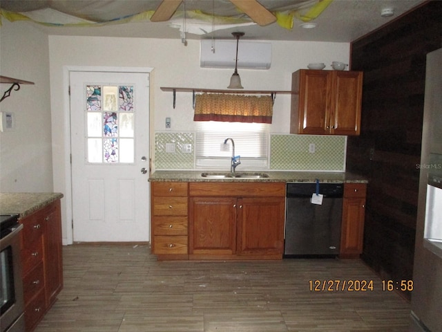 kitchen featuring decorative backsplash, appliances with stainless steel finishes, ceiling fan, and sink