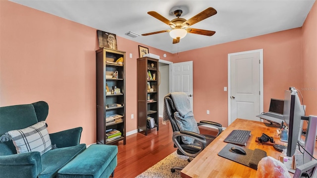 office featuring wood-type flooring and ceiling fan