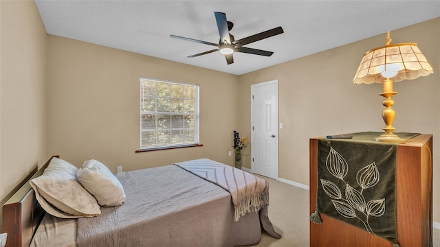 bedroom with ceiling fan and carpet floors