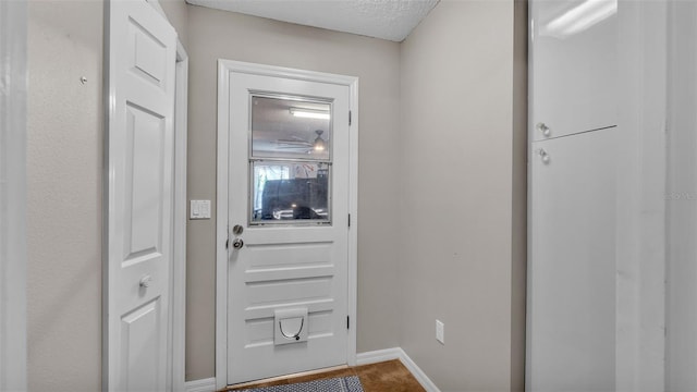 entryway featuring a textured ceiling