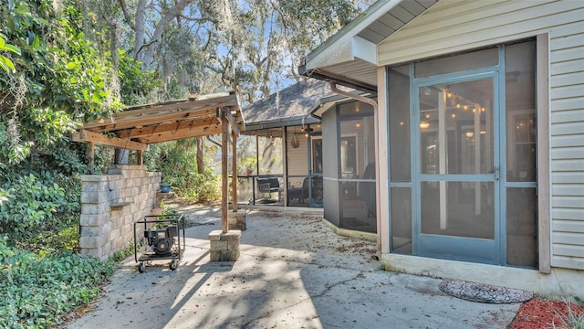 view of patio with a sunroom