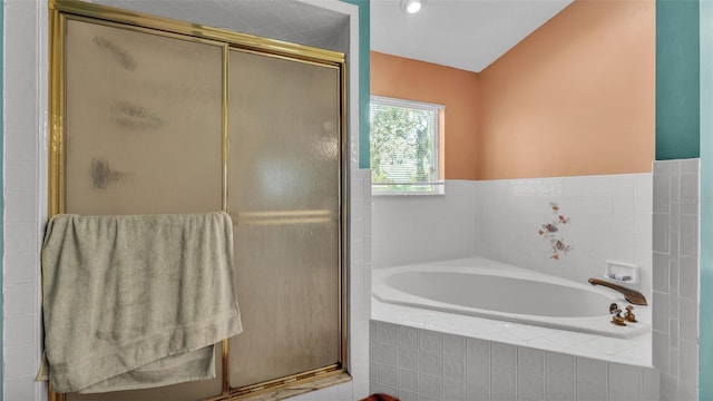 bathroom featuring lofted ceiling and shower with separate bathtub