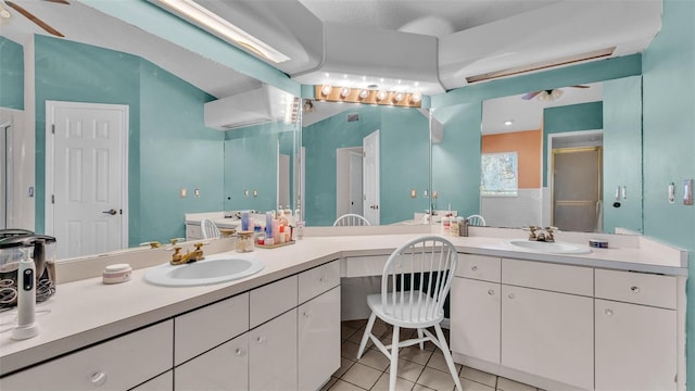 bathroom with vanity, tile patterned floors, and an enclosed shower