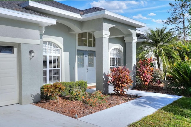 property entrance featuring french doors