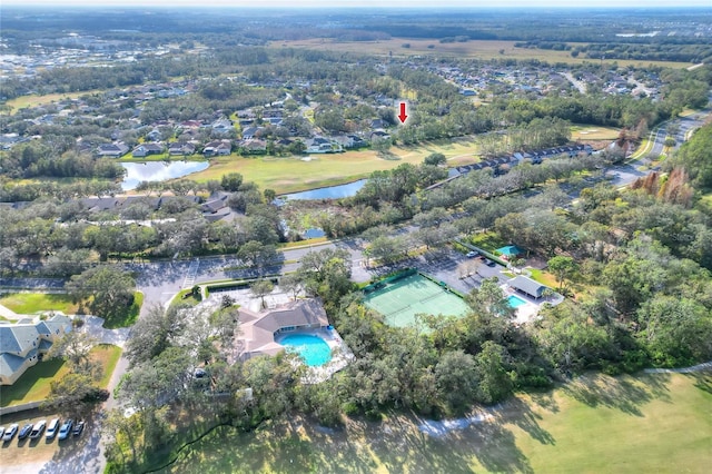 birds eye view of property with a water view