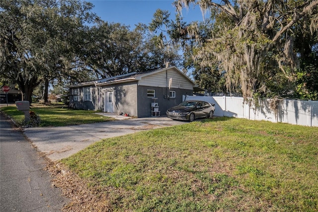 view of home's exterior featuring a lawn