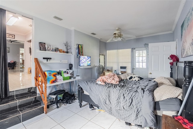 bedroom with ceiling fan, light tile patterned floors, and crown molding