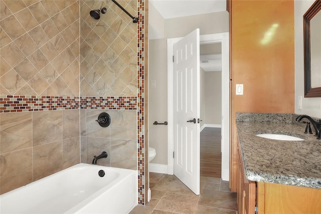 bathroom with vanity and tiled shower / bath combo