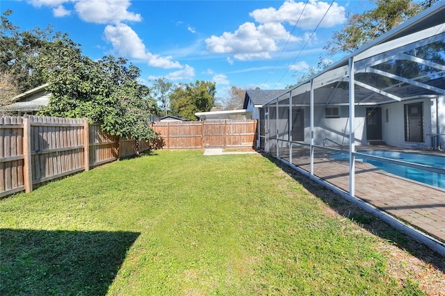 view of yard featuring a lanai and a fenced in pool