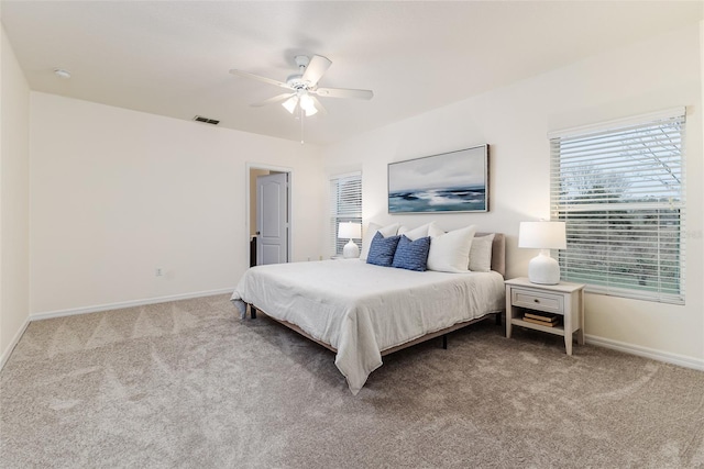 bedroom with ceiling fan and carpet floors