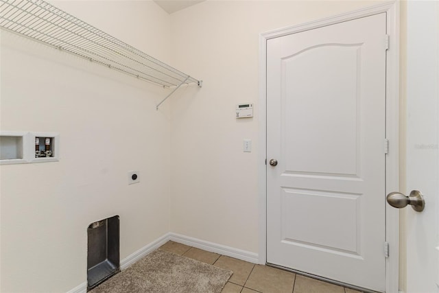 laundry room with hookup for a washing machine, hookup for an electric dryer, and light tile patterned floors