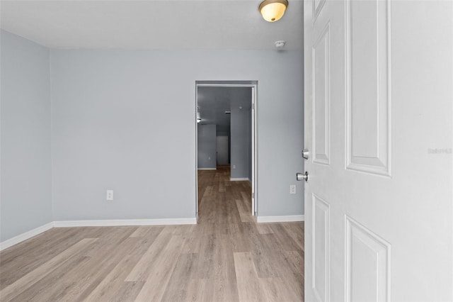 spare room featuring light hardwood / wood-style floors