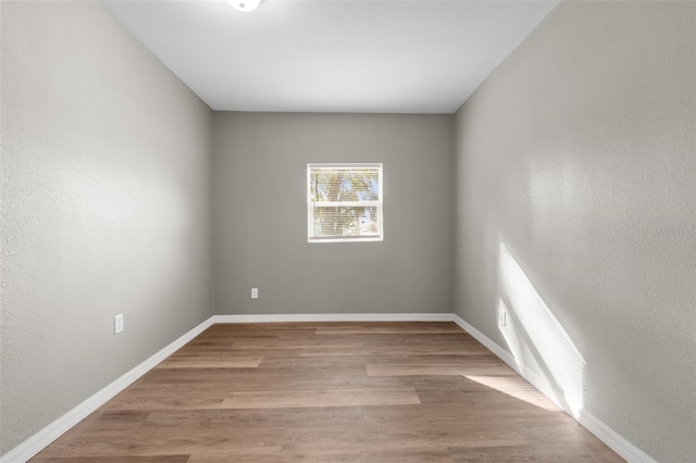 spare room featuring light hardwood / wood-style flooring