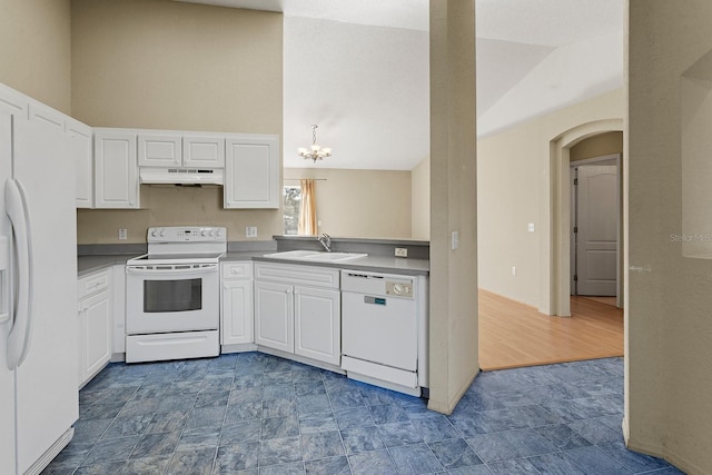 kitchen featuring vaulted ceiling, sink, white cabinets, and white appliances