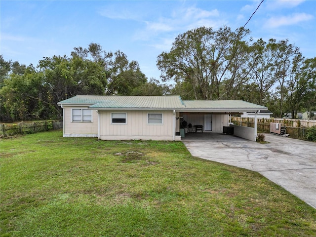 210 Wilder Rd, Lakeland, FL 33809 - back of house with a yard and a carport