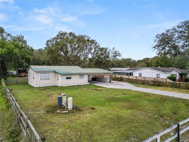 210 Wilder Rd, Lakeland, FL 33809 - ranch-style house featuring a front yard and a carport