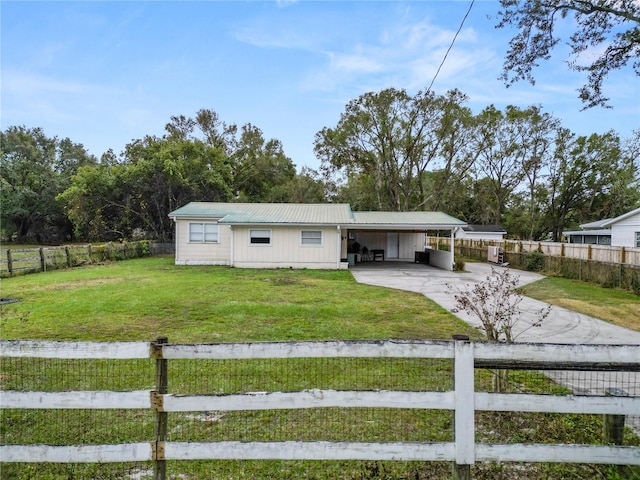 210 Wilder Rd, Lakeland, FL 33809 - view of front of house with a front lawn and a carport