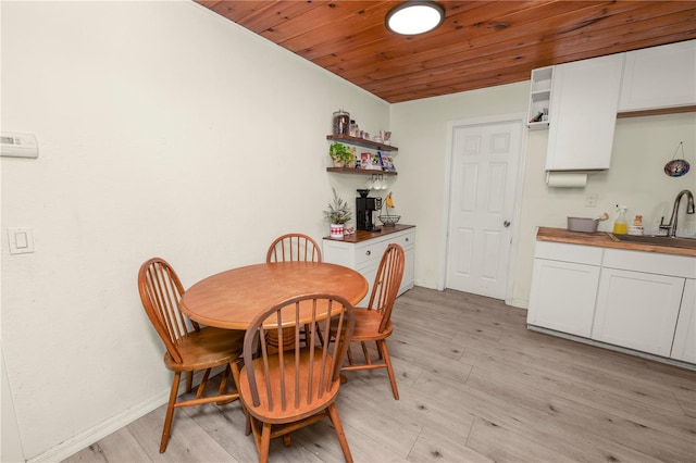 210 Wilder Rd, Lakeland, FL 33809 - dining room with light hardwood / wood-style floors, wooden ceiling, and sink