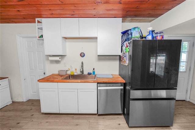 210 Wilder Rd, Lakeland, FL 33809 - kitchen featuring dishwasher, white cabinets, black fridge, and sink
