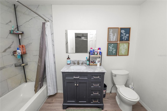 210 Wilder Rd, Lakeland, FL 33809 - full bathroom with vanity, shower / bath combination with curtain, hardwood / wood-style flooring, ceiling fan, and toilet