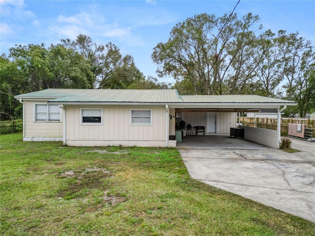 210 Wilder Rd, Lakeland, FL 33809 - exterior space with a carport and a lawn