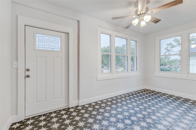 foyer entrance with ceiling fan