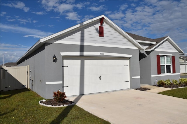 exterior space with a garage and a front lawn