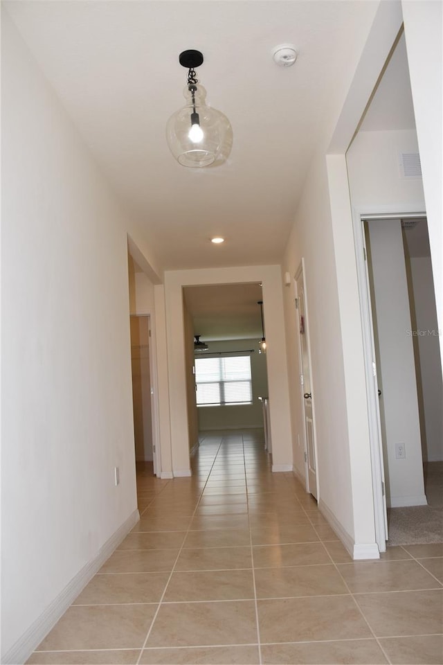 hallway with light tile patterned flooring