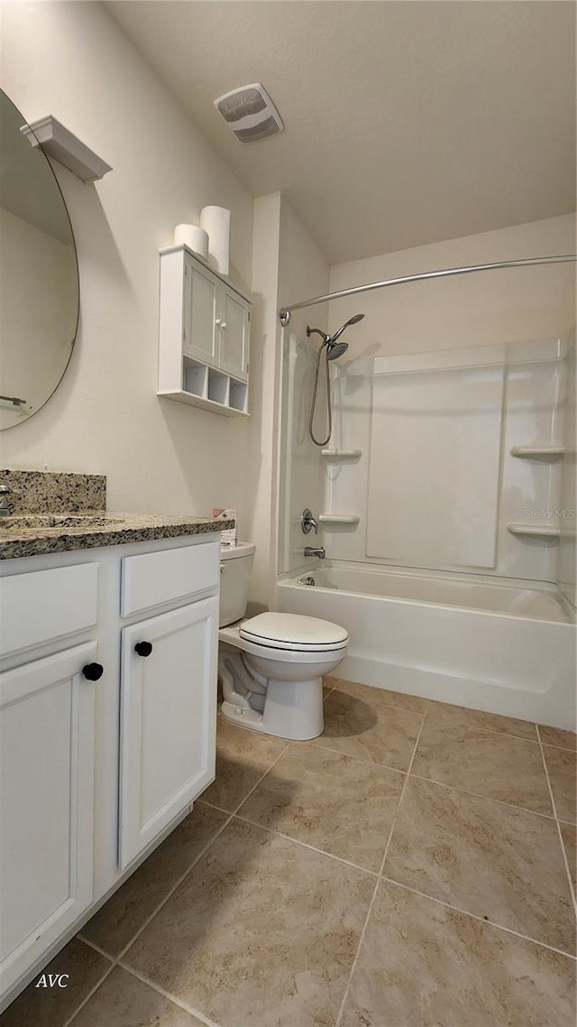 full bathroom with shower / tub combination, vanity, toilet, and tile patterned floors