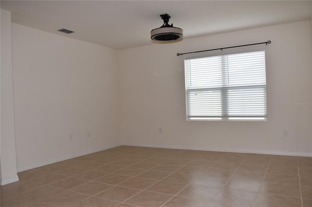 unfurnished room featuring light tile patterned floors