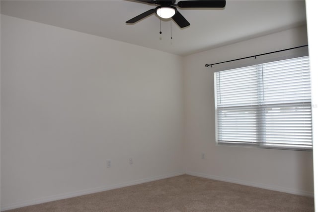 unfurnished room featuring ceiling fan and light carpet