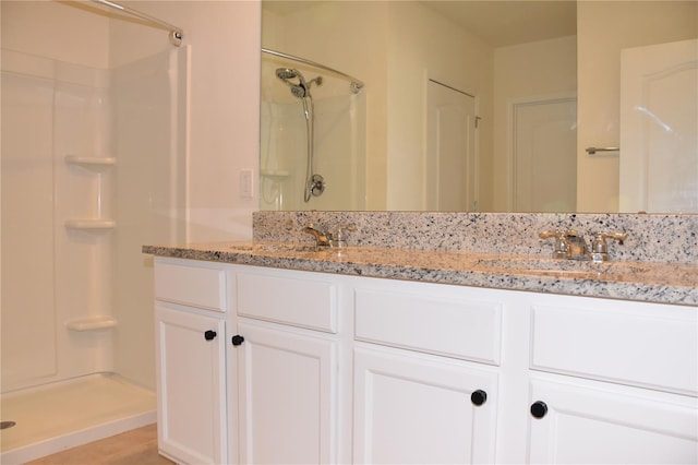 bathroom featuring vanity and walk in shower