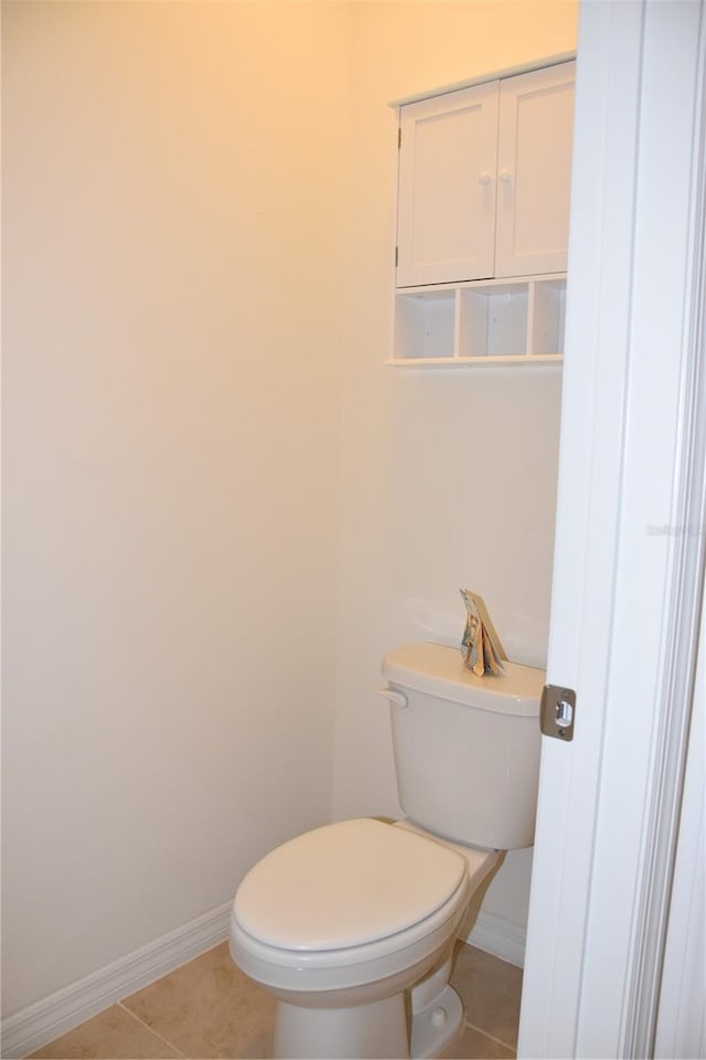 bathroom featuring tile patterned floors and toilet