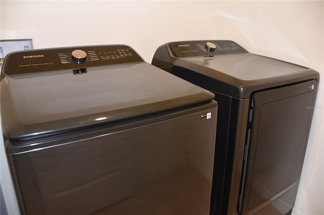 laundry area with washing machine and dryer