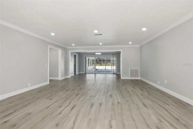 unfurnished living room featuring crown molding and light hardwood / wood-style floors