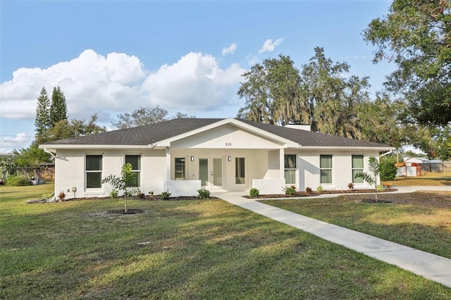 ranch-style home with a porch and a front lawn