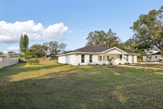 single story home featuring a front lawn