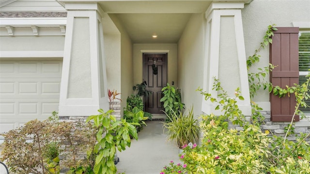 doorway to property featuring a garage