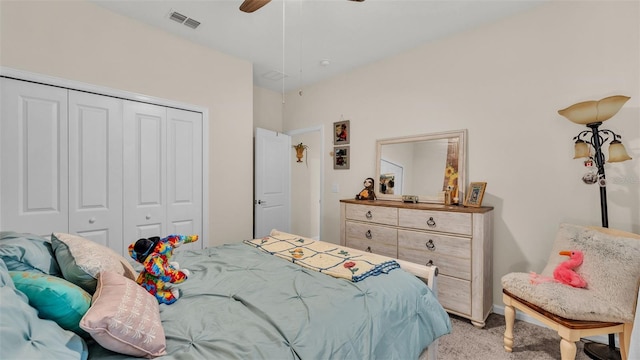 bedroom with light carpet, a closet, and ceiling fan