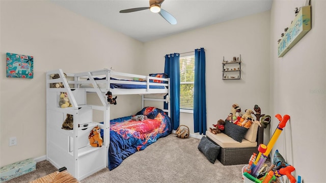 bedroom featuring ceiling fan and carpet