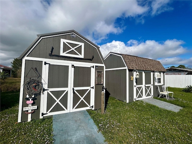 view of outdoor structure featuring a yard