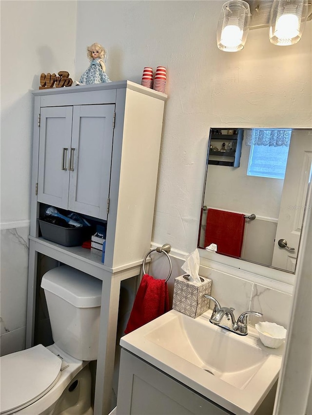 bathroom with vanity and toilet