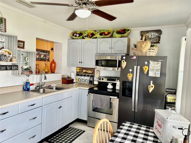 kitchen featuring stainless steel appliances, crown molding, sink, light tile patterned floors, and white cabinets